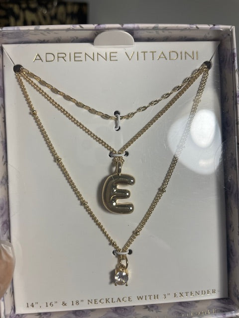 Layered gem necklaces with an 'E'