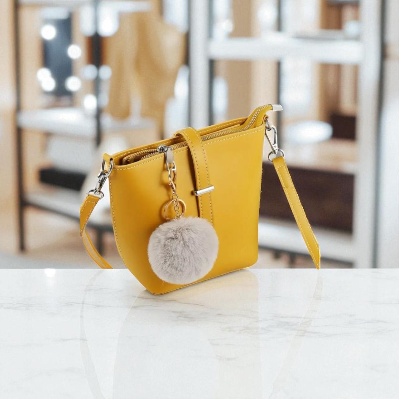 Yellow handbag, pom-pom keychain