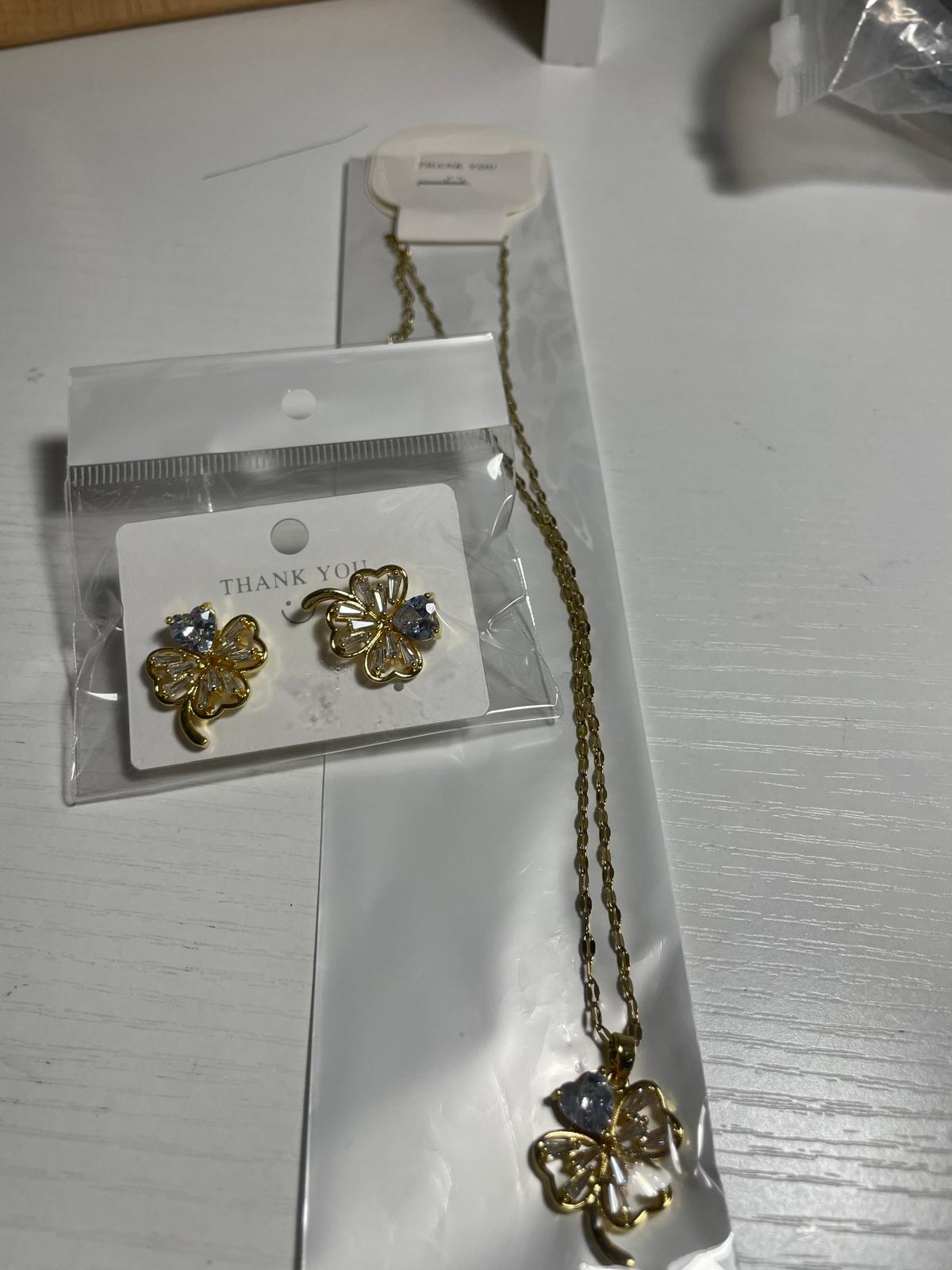 Gold and clear crystal clover necklace and earrings