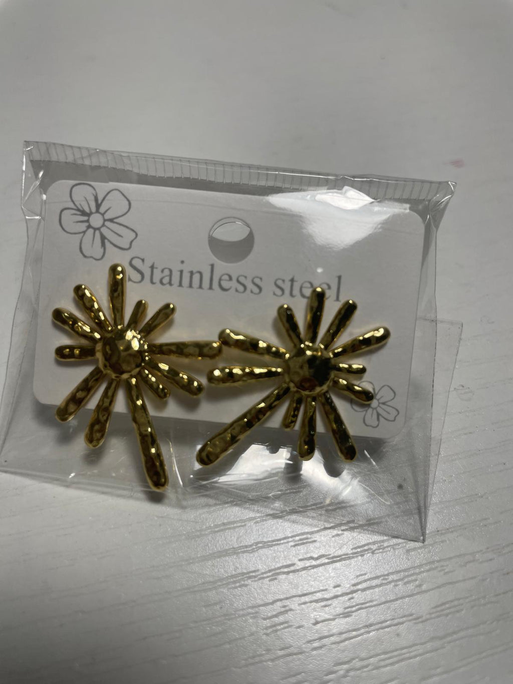 Gold sun-shaped earrings