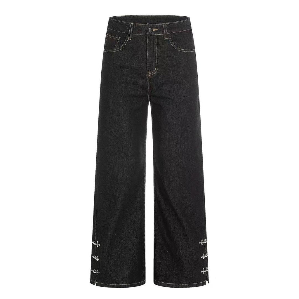 Black flare jeans with cross ring hem hardware - flat lay