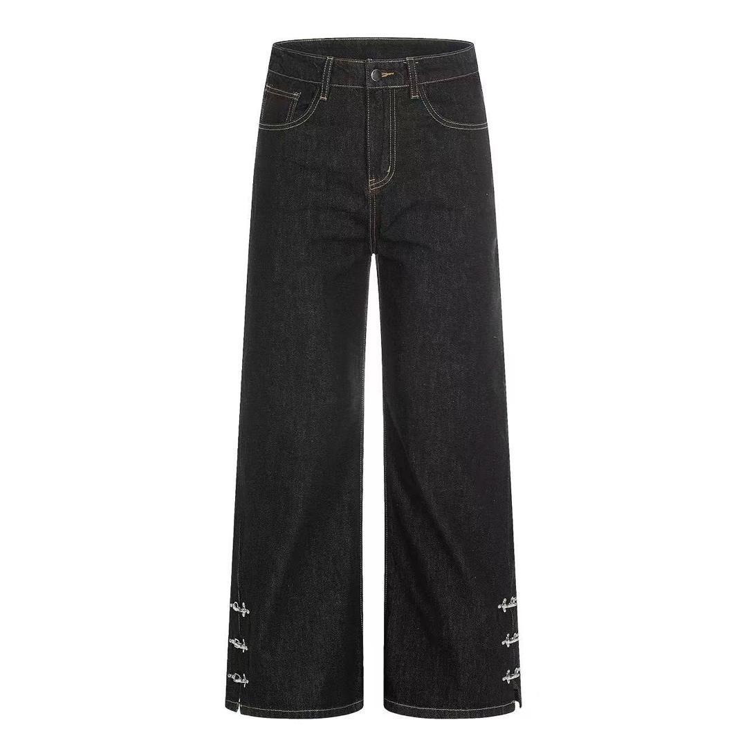 Black flare jeans with cross ring hem hardware - flat lay