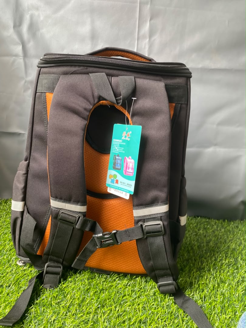 Dark brown and black Hucheng backpack with bright orange accents