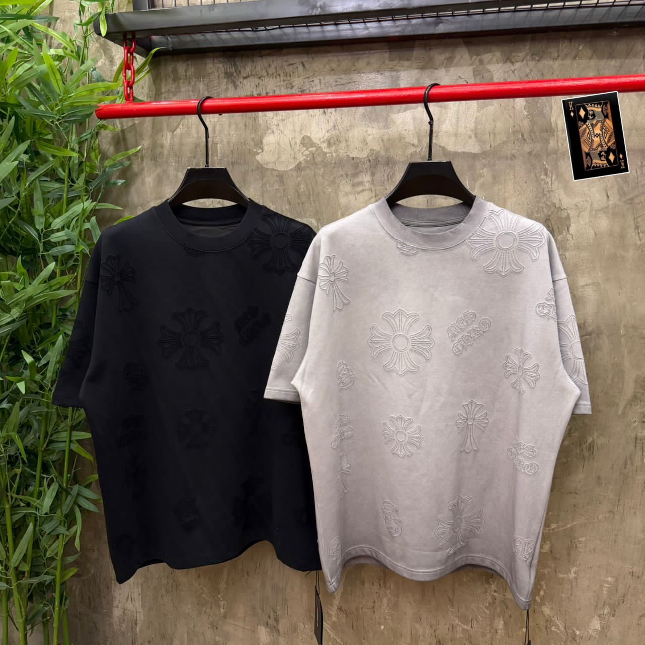 Chrome Hearts allover cross embroidered tee - black and grey side by side on rail