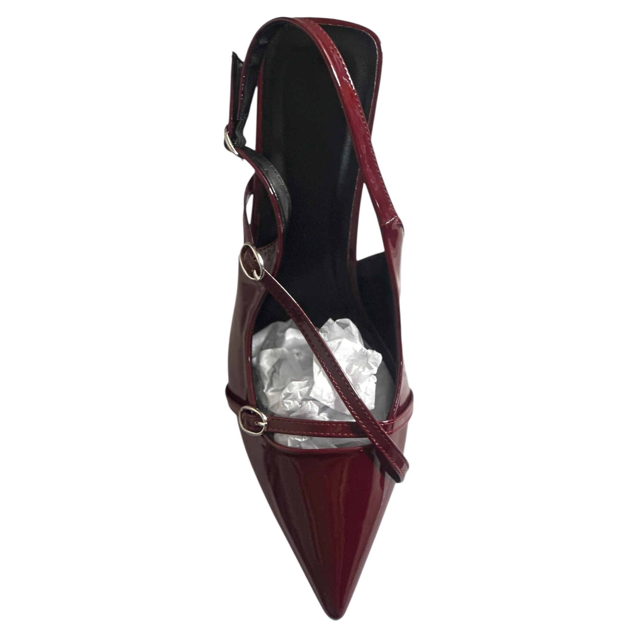 Red high-heeled shoe with a pointed toe and thin strap