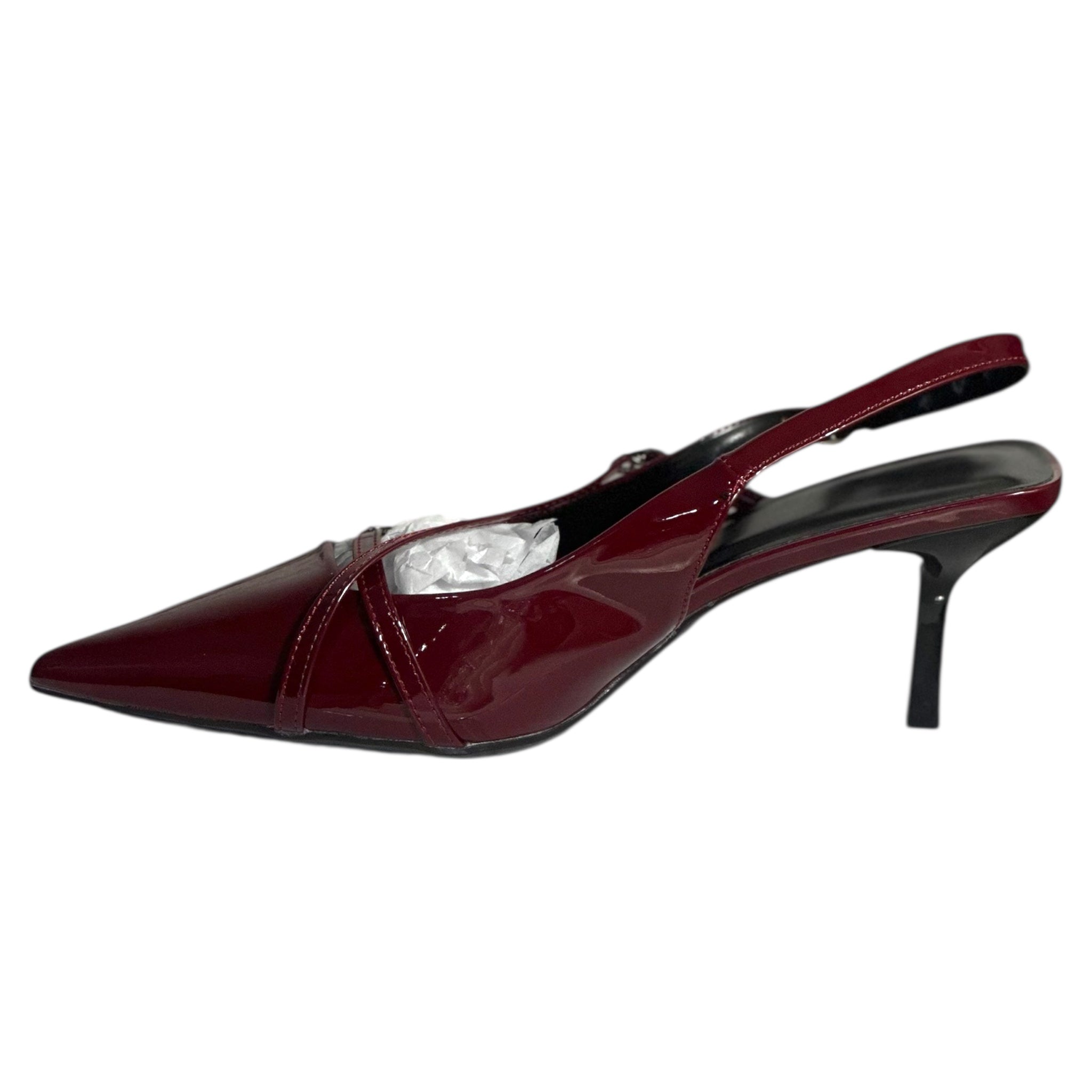 Red high-heeled shoe with a pointed toe and thin strap