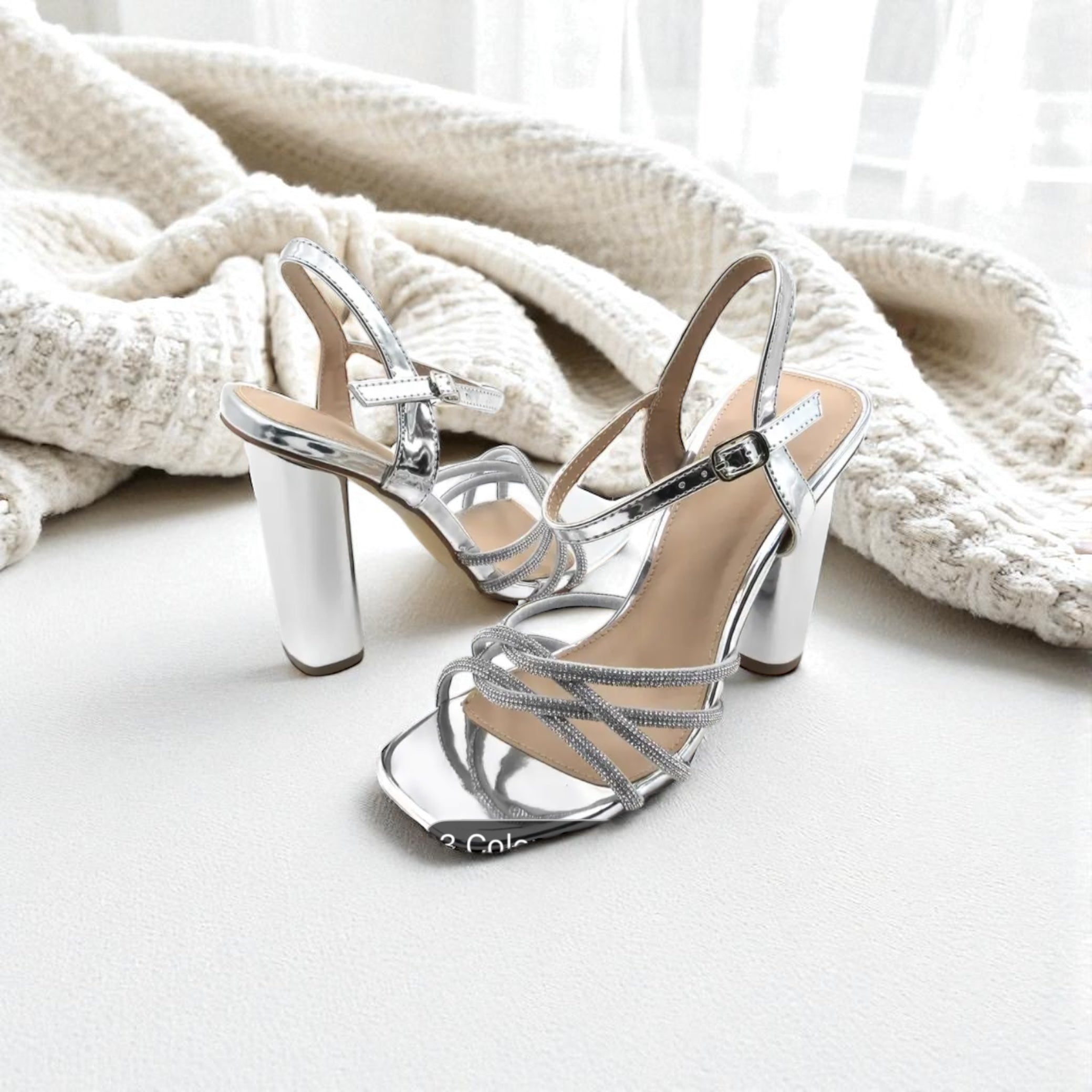 Silver strappy high-heeled sandals