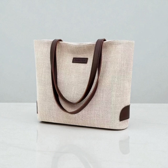 Beige tote bag with brown handles